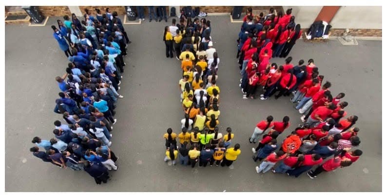 Holy Cross learners forming the number 115 for the school anniversary